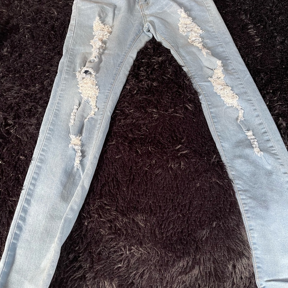 Distressed Light Blue Women's Jeans unbranded ,no material tag ,slight stretch .